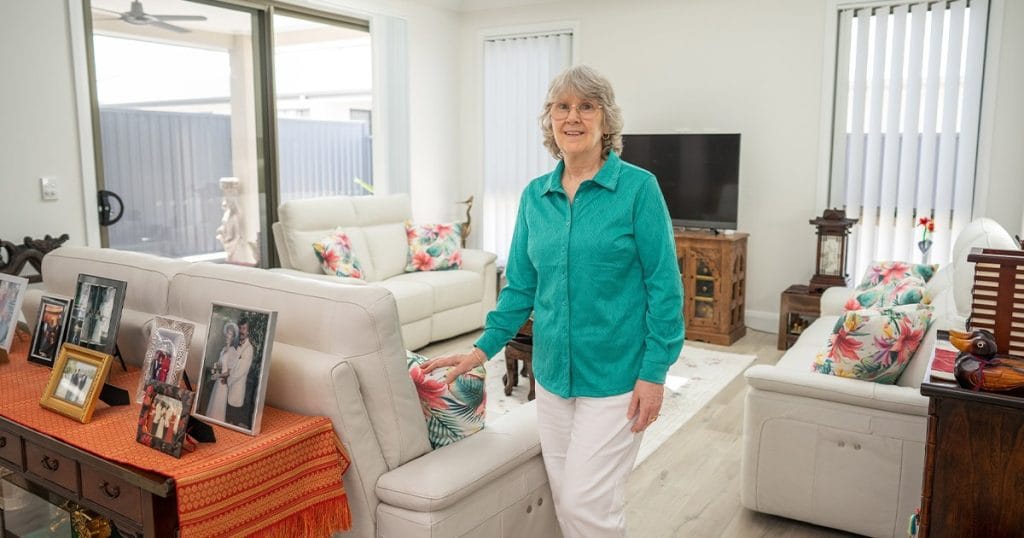 Over 50s resident in her lifestyle resort home living room