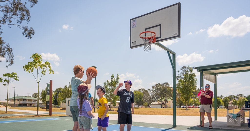Amber resident playing basketball with grandchildren